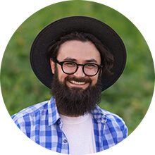Portrait of a modern creative professional or artisan supplier with a lush green natural background.