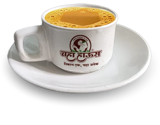 A cup of frothy hot milk tea in a white ceramic cup and saucer featuring the 'Chaha House' logo.